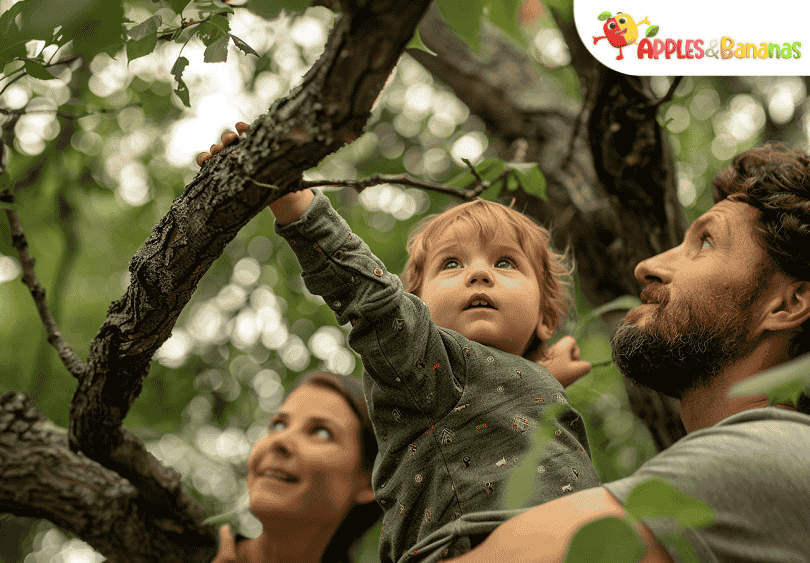 Children playing outdoors in a green park, running, climbing, and exploring nature with smiles on their faces.