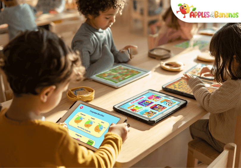 Smiling toddler playing a colorful matching game on a tablet, learning shapes and colors using the Apples and Bananas app.